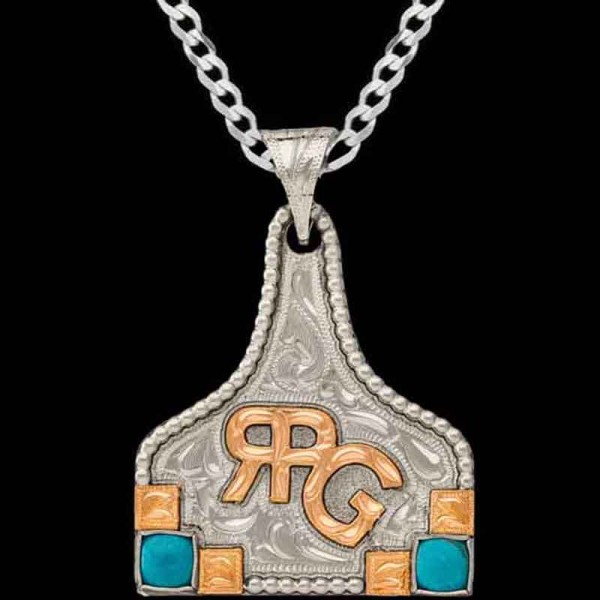 Clarabelle, German Silver base 1.75"x1.50" and a beaded edge. Copper ranch logo, and hand-engraved squares beside 2 simulated turquoise stones.

Chain not 